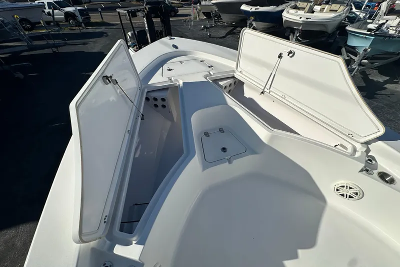Slide: The Image of 2013 Sportsman Masters 247 Bay Boat with open storage compartments on deck. - 10