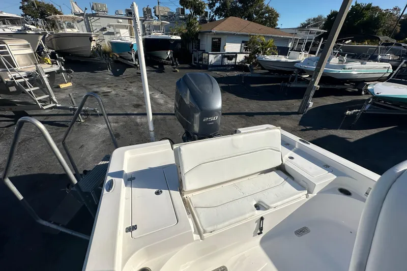 Slide: The Image of 2013 Sportsman Masters 247 Bay Boat with 250 HP engine in a boatyard. - 20