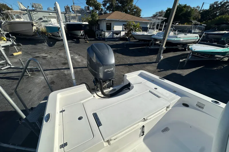 Slide: The Image of 2013 Sportsman Masters 247 Bay Boat with Yamaha 250 engine in a boatyard setting. - 21