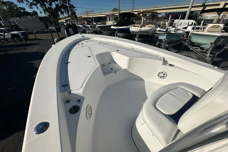 Slide: The Image of 2013 Sportsman Masters 247 Bay Boat interior, showcasing seating and deck features. - 8