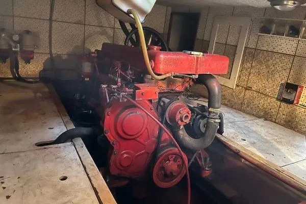 Slide: The Image of Engine room of a 1981 Marine Trader trunk cabin trawler with a red engine. - 7