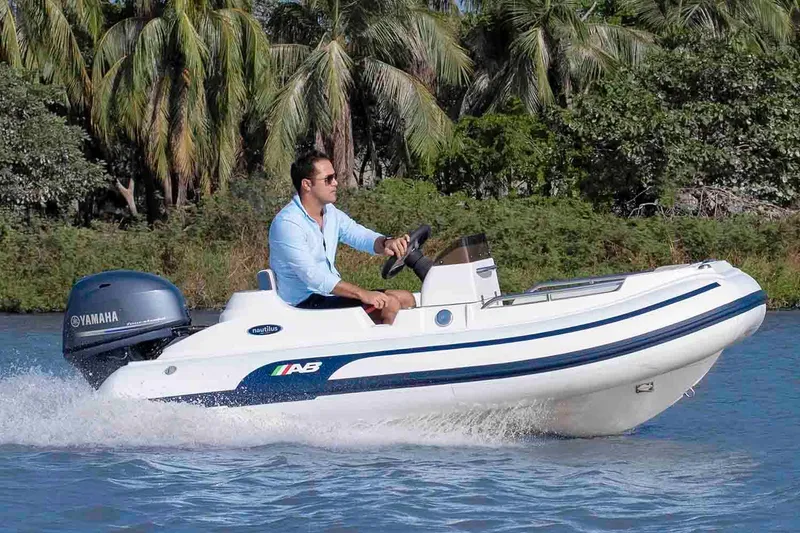 Slide: The Image of Manufacturer Provided Image: Man driving 2026 AB Inflatables Nautilus 11 DLX on water. - 4