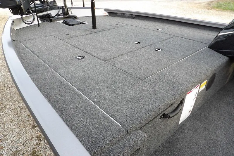 Slide: The Image of 2026 Crestliner XFC 189 boat deck with carpeted storage compartments. - 11
