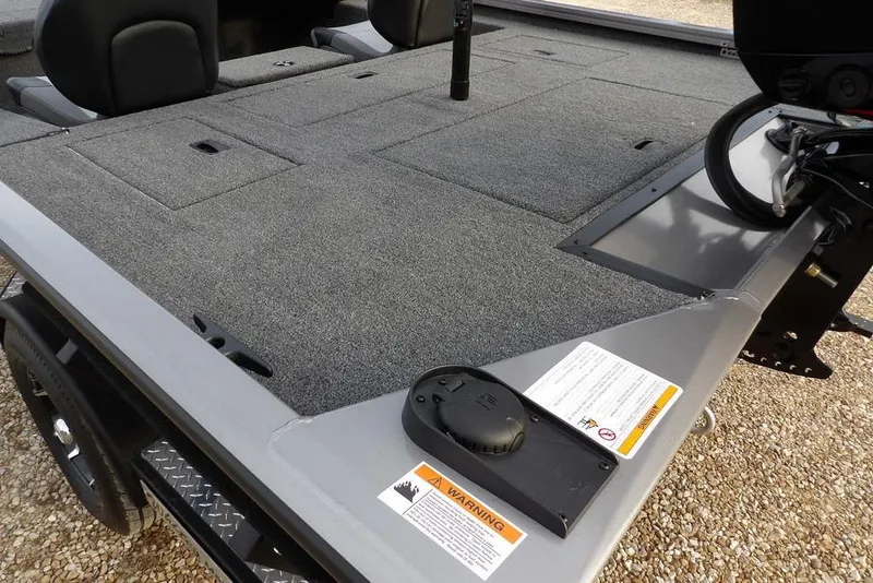 Slide: The Image of 2026 Crestliner XFC 189 boat deck with carpeted surface and seating. - 12