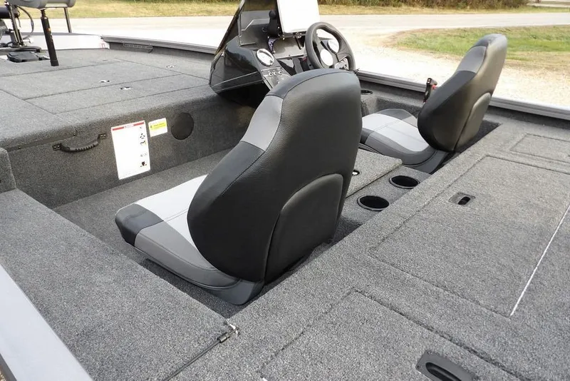 Slide: The Image of 2026 Crestliner XFC 189 boat interior with dual seats and carpeted deck. - 13