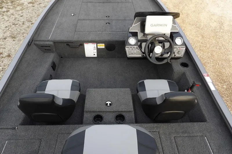 Slide: The Image of 2026 Crestliner XFC 189 boat interior with Garmin system, dual seats, and steering console. - 16