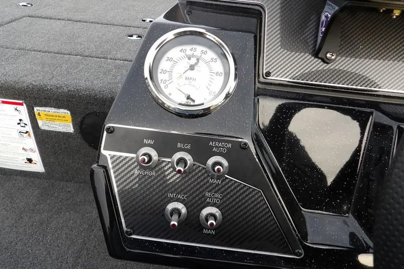 Slide: The Image of Dashboard of 2026 Crestliner XFC 189 boat with speedometer and control switches. - 20