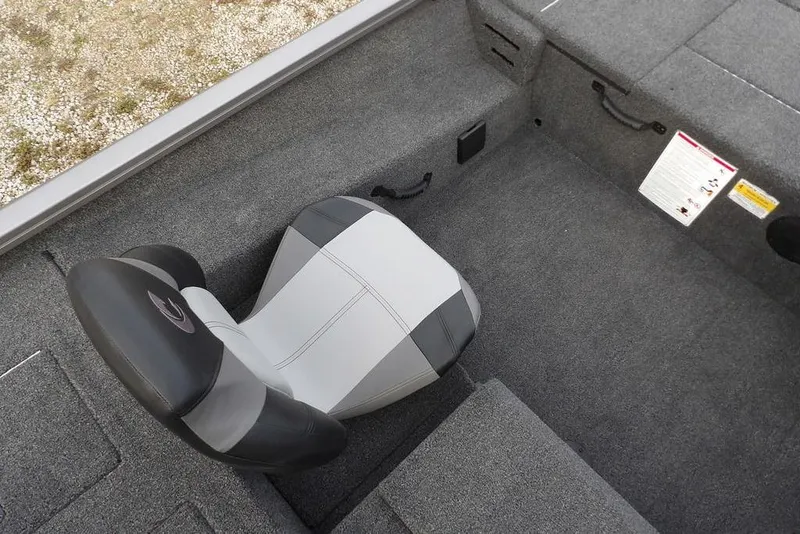 Slide: The Image of 2026 Crestliner XFC 189 boat interior with gray seating and carpeted flooring. - 22