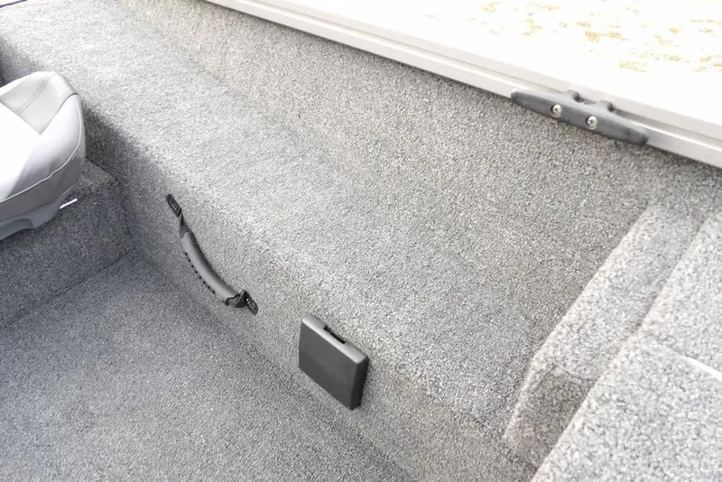 Slide: The Image of 2026 Crestliner XFC 189 boat interior with gray carpet and seating detail. - 32