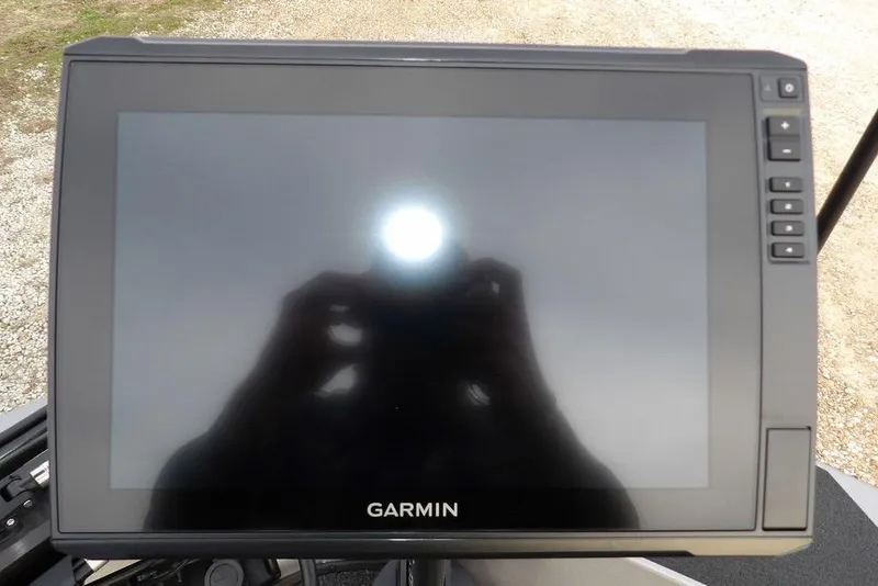 Slide: The Image of Garmin display screen on 2026 Crestliner XFC 189 boat, reflecting sunlight. - 40