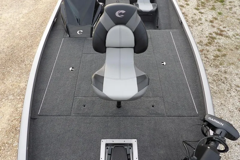 Slide: The Image of 2026 Crestliner XFC 189 boat interior with gray seating and Garmin equipment. - 42