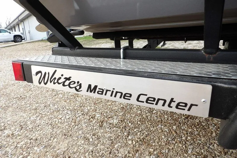 Slide: The Image of Trailer with "White's Marine Center" sign for 2026 Crestliner XFC 189 boat. - 49