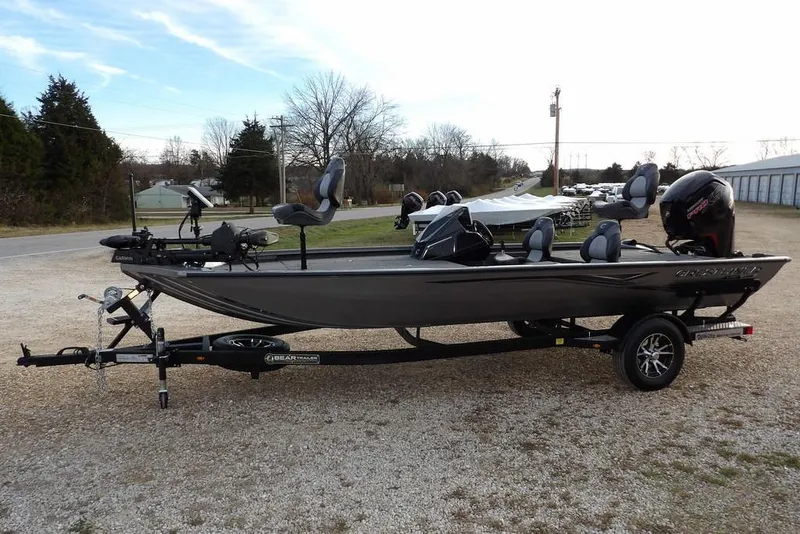 Slide: The Image of 2026 Crestliner XFC 189 fishing boat on trailer, parked outdoors. - 7