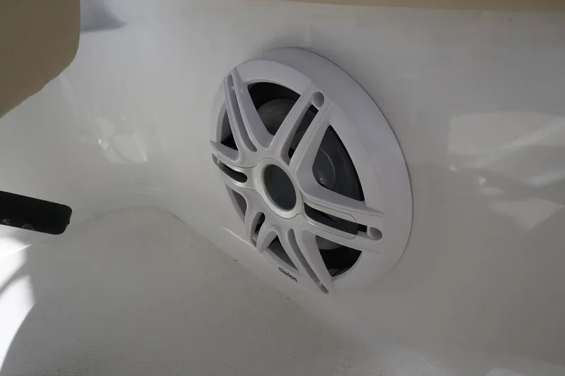 Slide: The Image of 2018 Hurricane SunDeck 2400 OB boat speaker, white interior detail. - 13