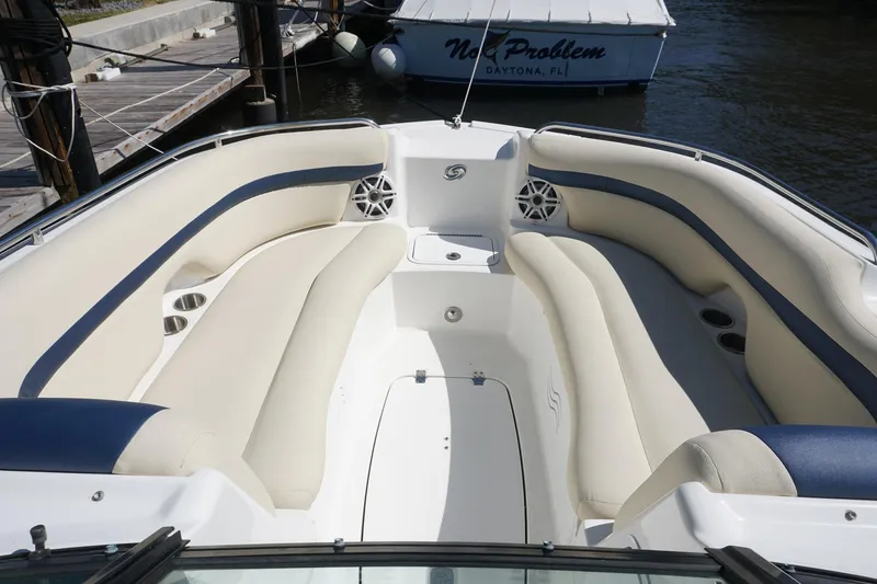 Slide: The Image of 2018 Hurricane SunDeck 2400 OB boat interior with spacious seating and cup holders. - 5