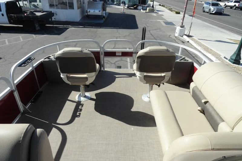 Slide: The Image of 2022 Sun Tracker Fishin' Barge 20 DLX interior with seating and open deck space. - 14