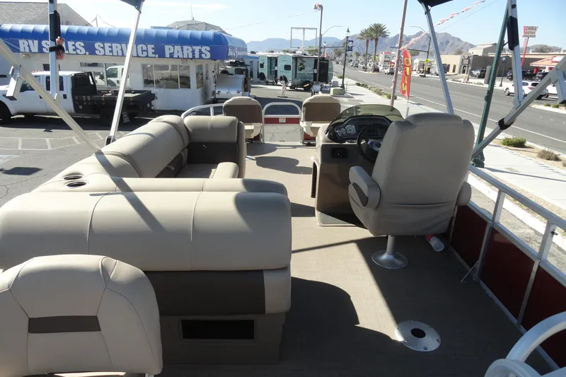 Slide: The Image of 2022 Sun Tracker Fishin' Barge 20 DLX interior with seating and steering console. - 6