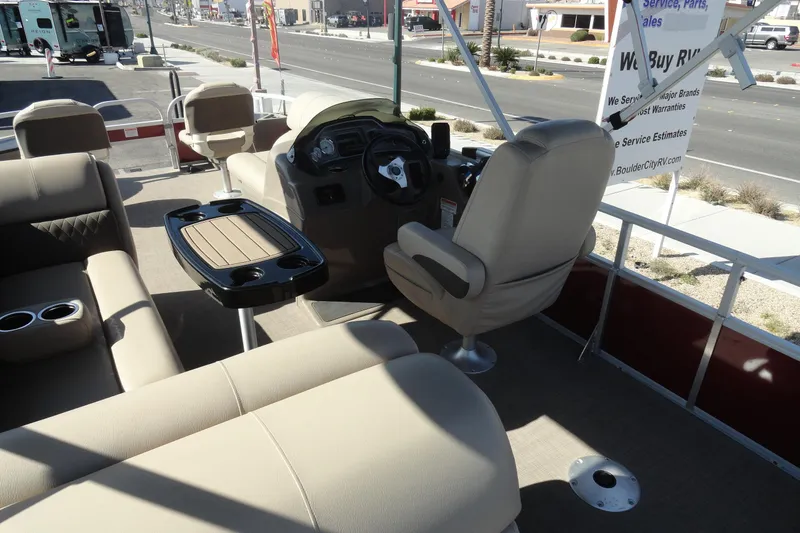 Slide: The Image of 2022 Sun Tracker Fishin' Barge 20 DLX interior with seating and steering console. - 7