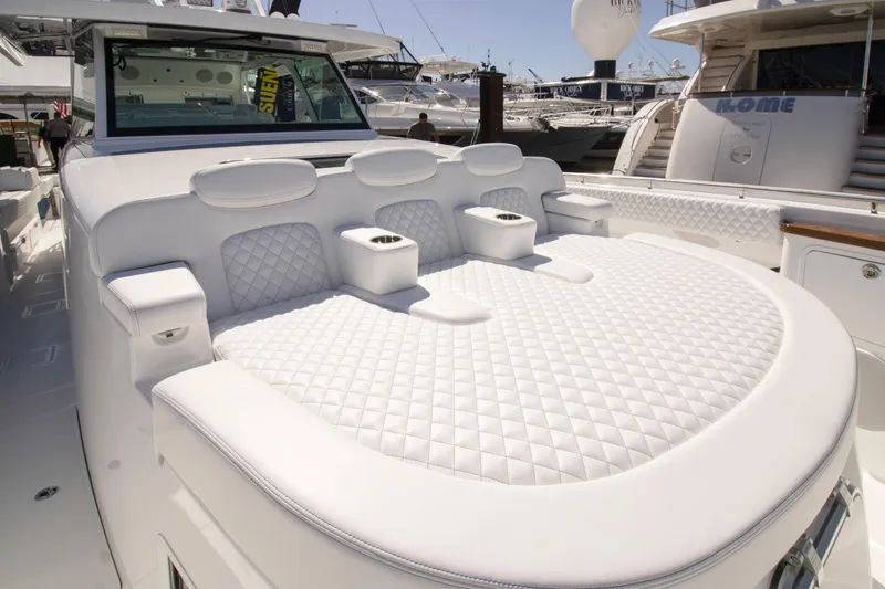 Slide: The Image of Luxurious 2025 HCB 56 Suenos GIX yacht with plush white seating and elegant design. - 11