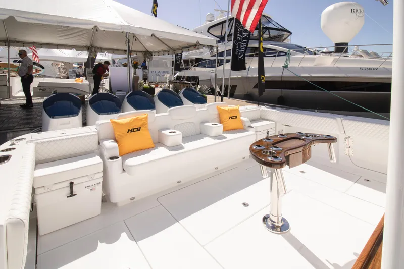 Slide: The Image of Luxury 2025 HCB 56 Suenos GIX yacht interior with seating and fishing amenities. - 13