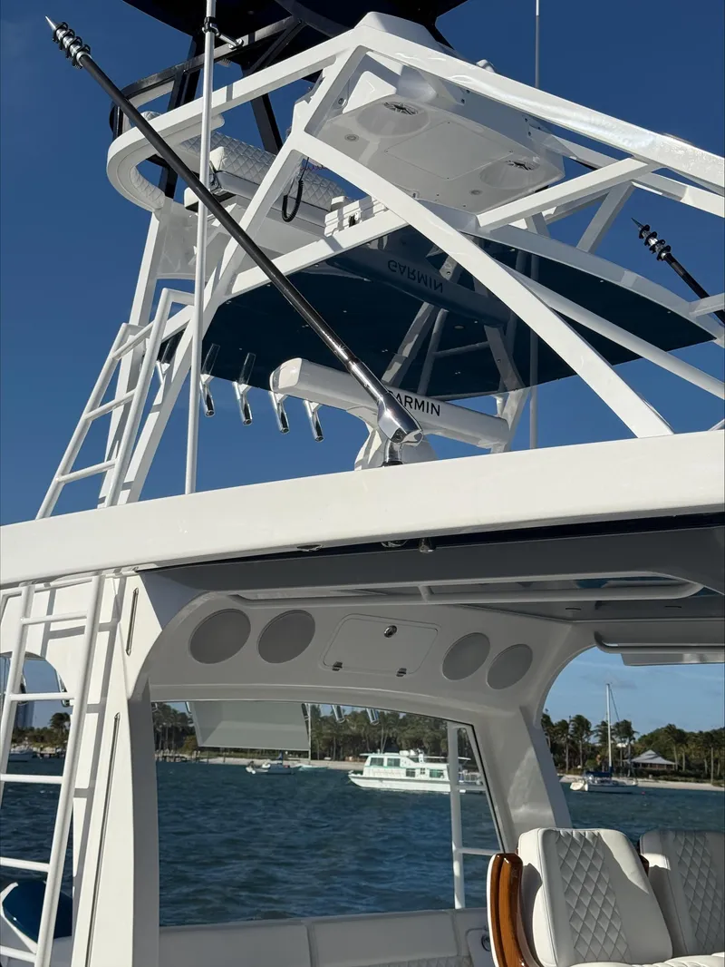 Slide: The Image of 2025 HCB 56 Suenos GIX boat tower and seating, with ocean backdrop. - 15