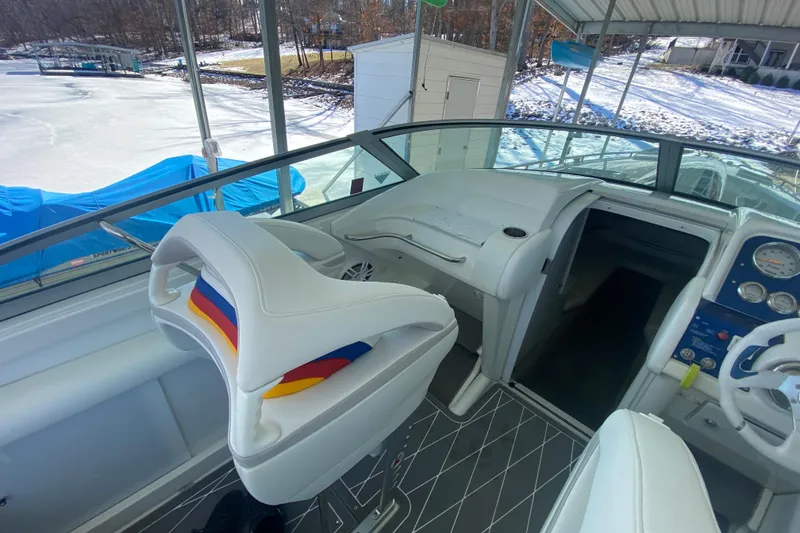Slide: The Image of 2006 Formula 353 FASTech boat interior with colorful seating and dashboard view. - 13