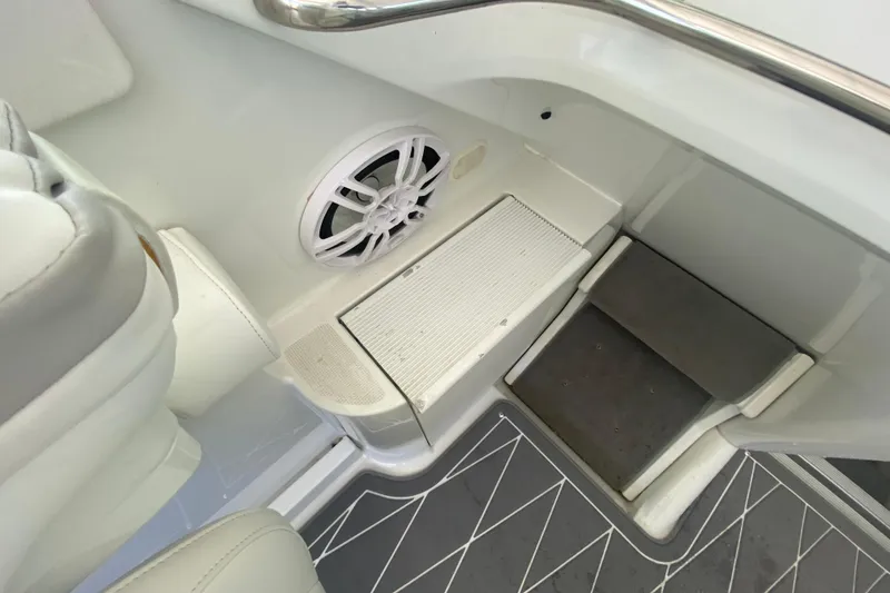 Slide: The Image of 2006 Formula 353 FASTech boat interior with speaker and steps, featuring sleek white design. - 14