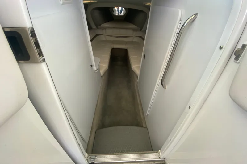 Slide: The Image of Interior cabin of a 2006 Formula 353 FASTech boat, featuring sleek white design. - 15