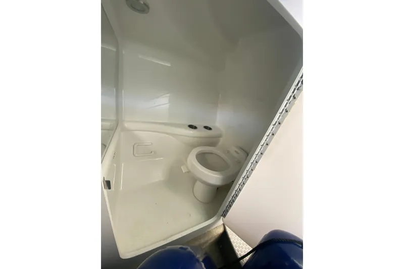 Slide: The Image of 2006 Formula 353 FASTech boat bathroom interior with white fixtures. - 20