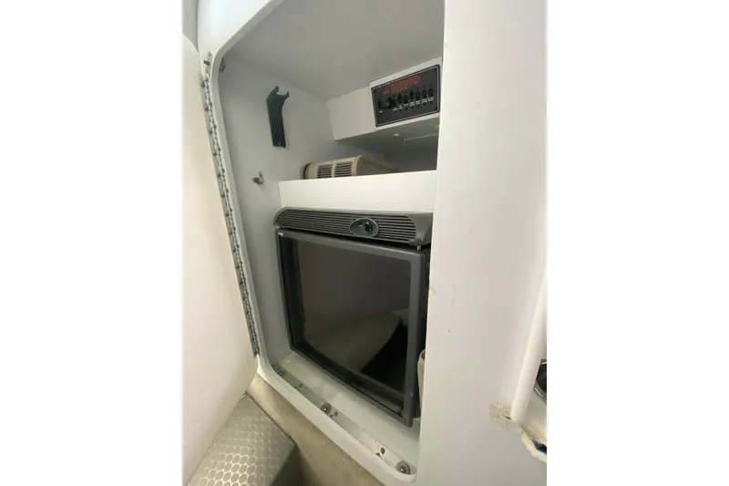 Slide: The Image of 2006 Formula 353 FASTech cabin interior with refrigerator and control panel. - 21