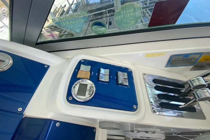 Slide: The Image of 2006 Formula 353 FASTech boat dashboard with controls and gauges. - 26