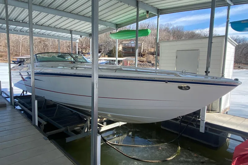 Slide: The Image of 2006 Formula 353 FASTech boat docked in a covered marina, winter setting. - 37