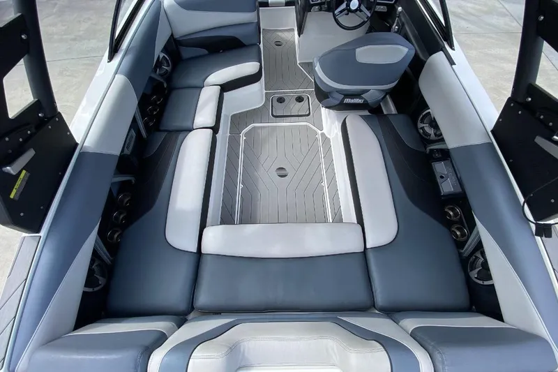 Slide: The Image of 2018 Malibu Wakesetter 22 MXZ interior with gray seating and modern design. - 3