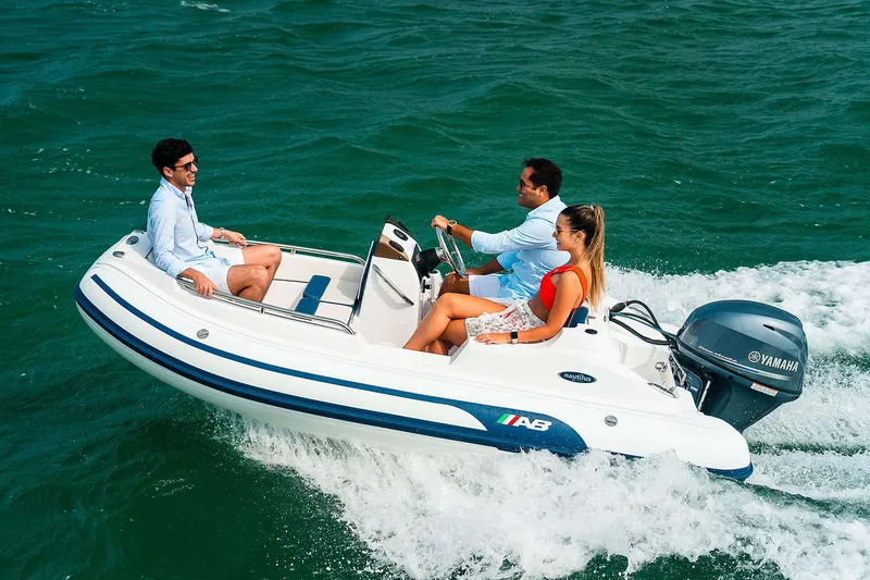 Slide: The Image of Manufacturer Provided Image: 2026 AB Inflatables Nautilus 12 DLX on water with three people. - 4