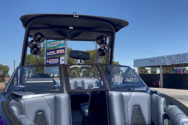 Slide: The Image of 2018 Malibu Wakesetter 21 VLX boat with sleek interior and tower speakers. - 4