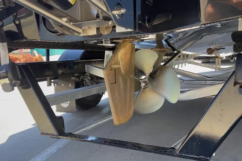 Slide: The Image of 2018 Malibu Wakesetter 21 VLX boat propeller and rudder detail. - 5
