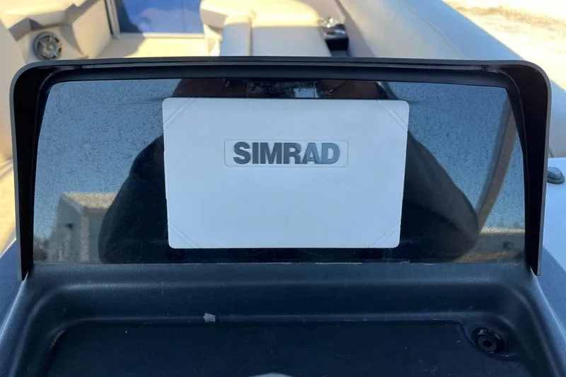 Slide: The Image of Simrad display on 2024 Harris Cruiser 230 boat dashboard. - 20
