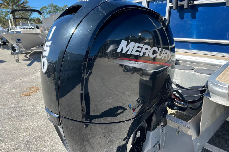 Slide: The Image of 2024 Harris Cruiser 230 with Mercury 150 FourStroke outboard engine. - 24