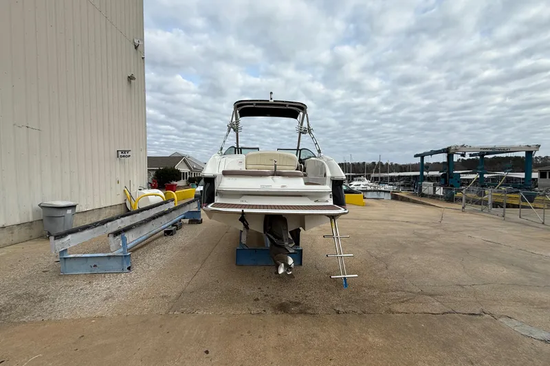 Slide: The Image of 2011 Cobalt 242 boat on dry dock with overcast sky. - 4