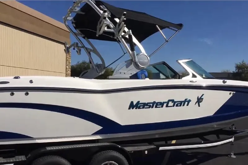 Slide: The Image of 2018 MasterCraft X46 boat with sleek design and wakeboard tower. - 5