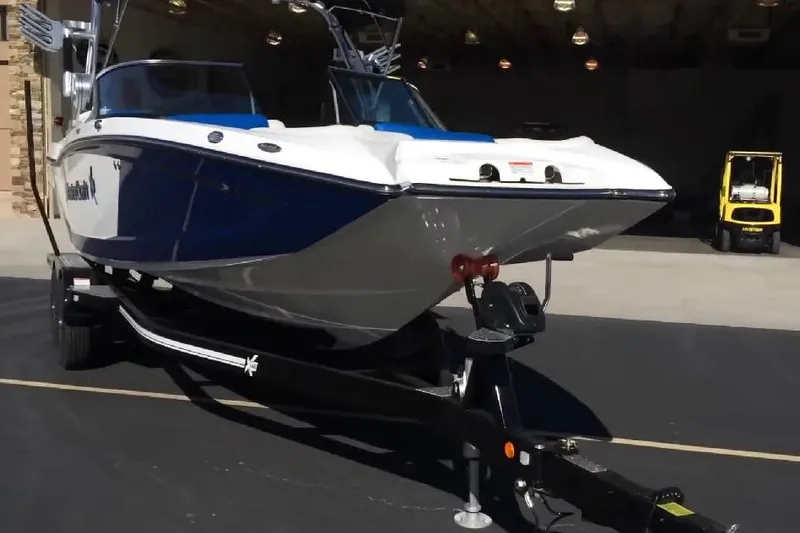 Slide: The Image of 2018 MasterCraft X46 boat on trailer, parked outdoors. - 6