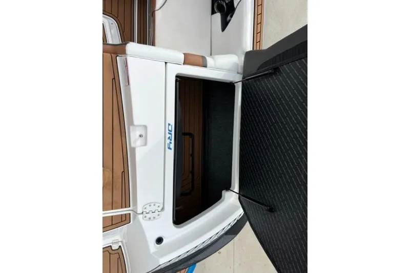 Slide: The Image of 2018 Nautique Super Air Nautique G23 interior storage compartment with open hatch. - 11
