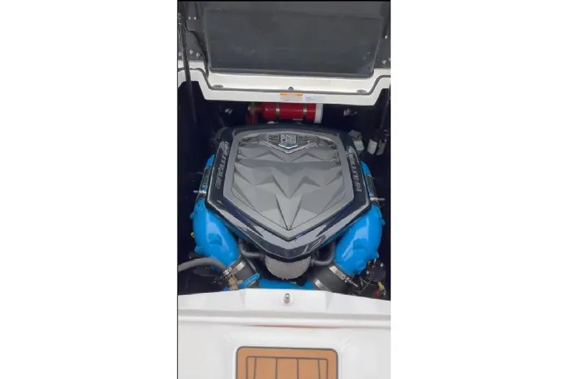 Slide: The Image of 2018 Nautique Super Air Nautique G23 engine compartment with PCM engine visible. - 20