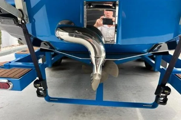 Slide: The Image of 2018 Nautique Super Air Nautique G23 boat stern with propeller and exhaust system. - 4