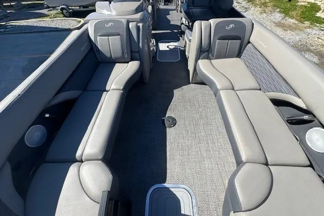 Slide: The Image of 2024 Barletta CORSA 25 QSSA pontoon boat interior with gray seating and carpeted floor. - 11