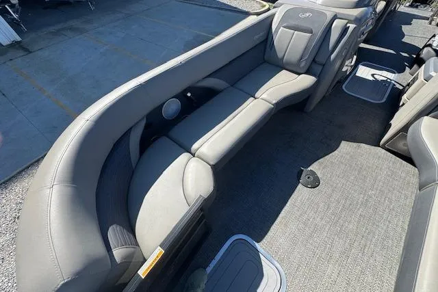 Slide: The Image of 2024 Barletta CORSA 25 QSSA boat interior with gray seating and carpeted floor. - 12