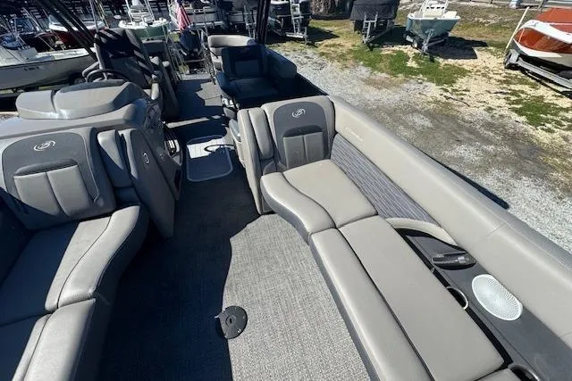 Slide: The Image of 2024 Barletta CORSA 25 QSSA pontoon boat interior with luxurious seating and modern design. - 13