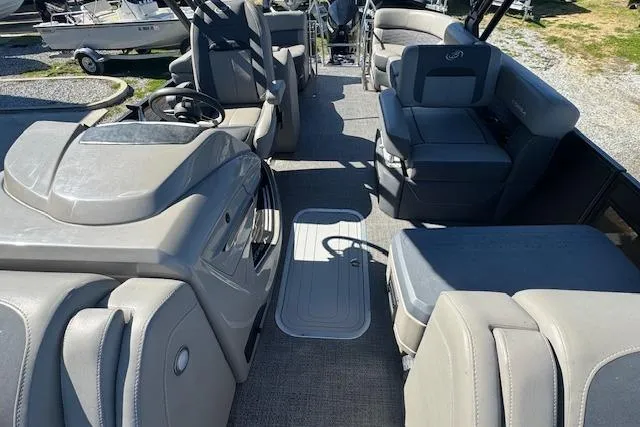 Slide: The Image of 2024 Barletta CORSA 25 QSSA pontoon boat interior with luxurious seating and modern design. - 14