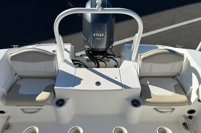 Slide: The Image of 2016 Robalo R200 Center Console boat interior with Yamaha 150 engine, featuring cushioned seating. - 12