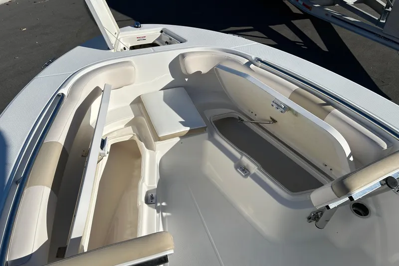 Slide: The Image of 2016 Robalo R200 Center Console boat interior with open storage compartments. - 13